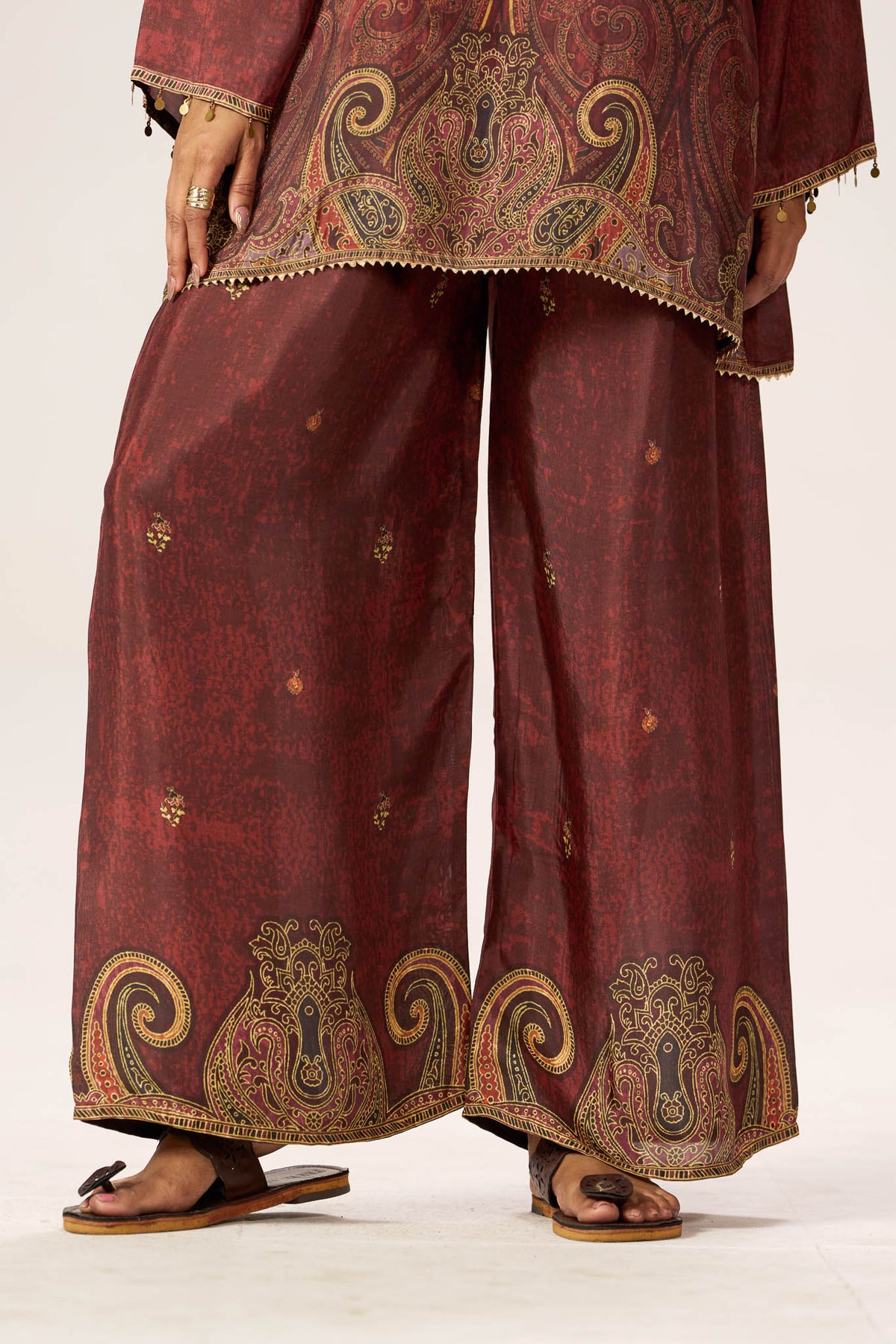 Maroon viscose wide-leg pants with paisley border detail